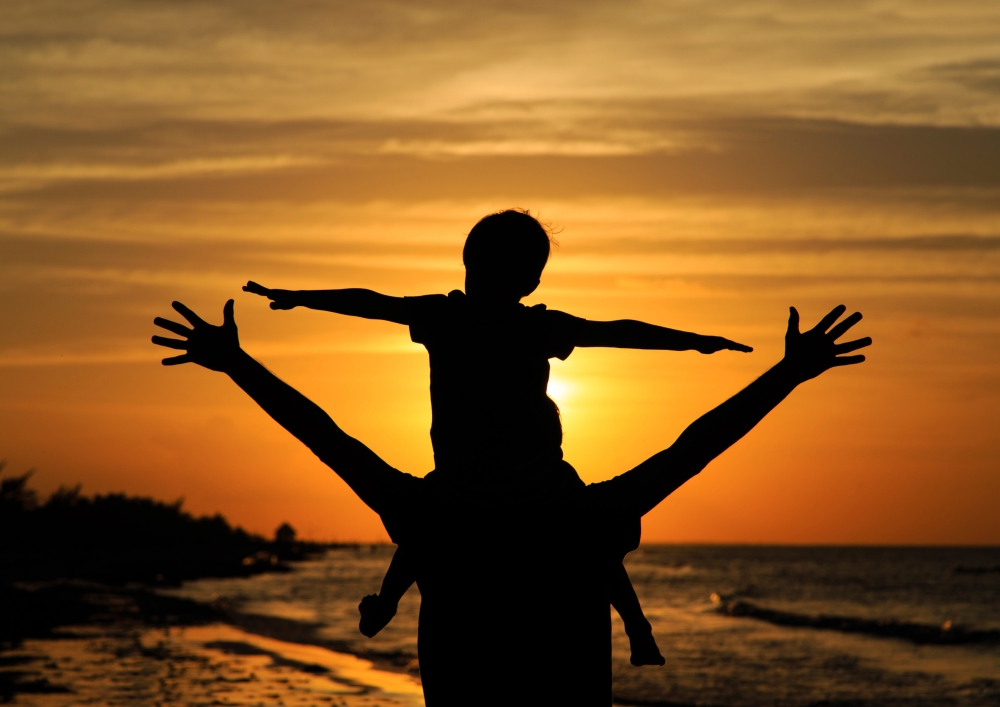 father-and-son-having-fun-at-sunset-000076451161_Large.jpg